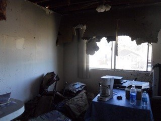Before: A room with a melted ceiling and burned furniture.